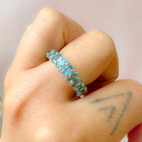 Oval Blue Topaz Almost Eternity Band