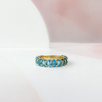Oval Blue Topaz Almost Eternity Band