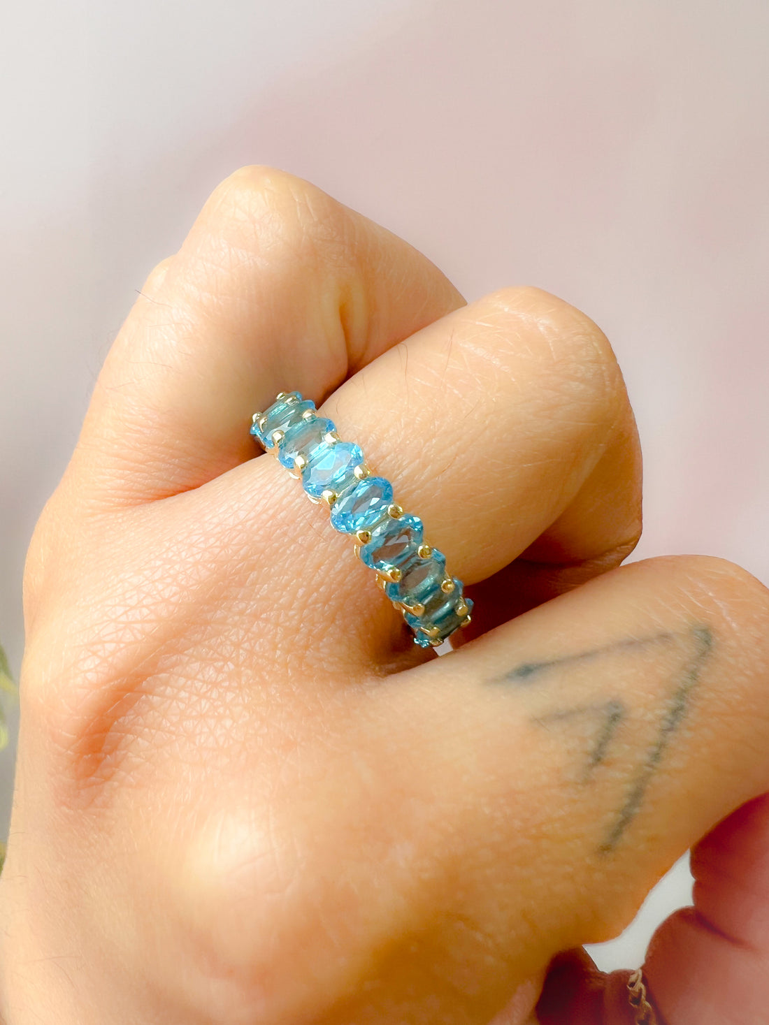 Oval Blue Topaz Almost Eternity Band